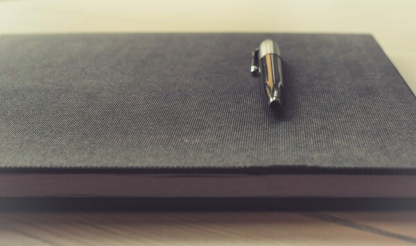 pen writing notebook